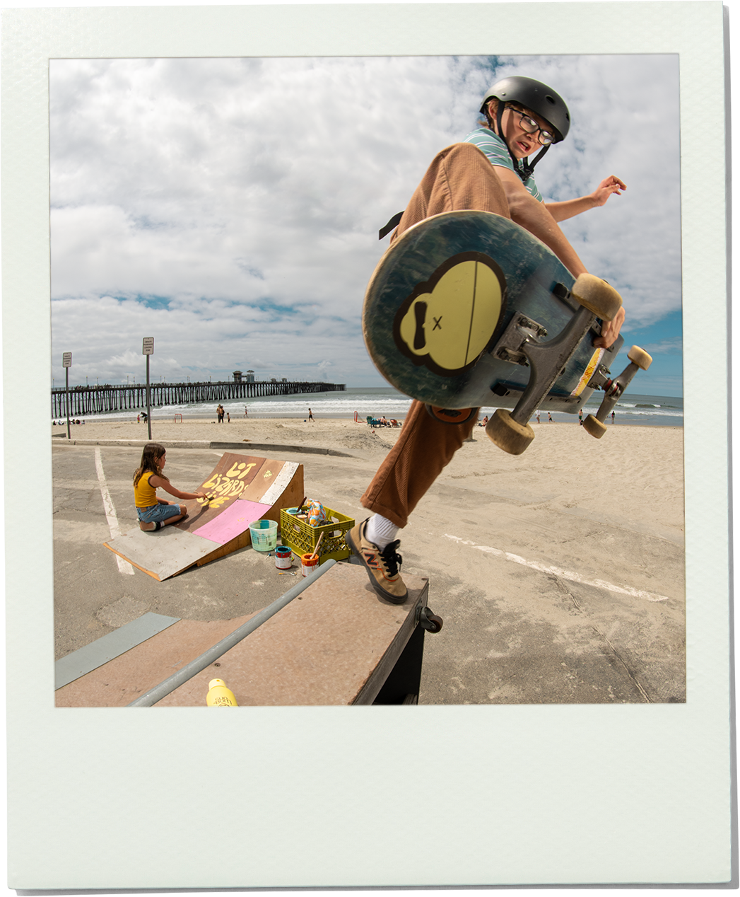 Skater catching air by the beach with a Sun Bum skateboard, showing off coastal vibes – Stick It Good Collection - Sun Bum