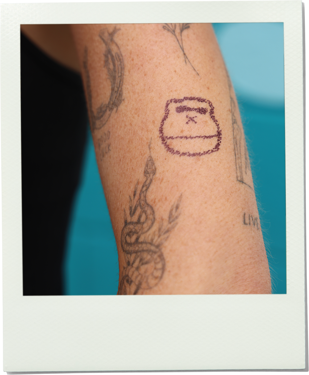 Sonny tattoo on a person's arm with a blue background