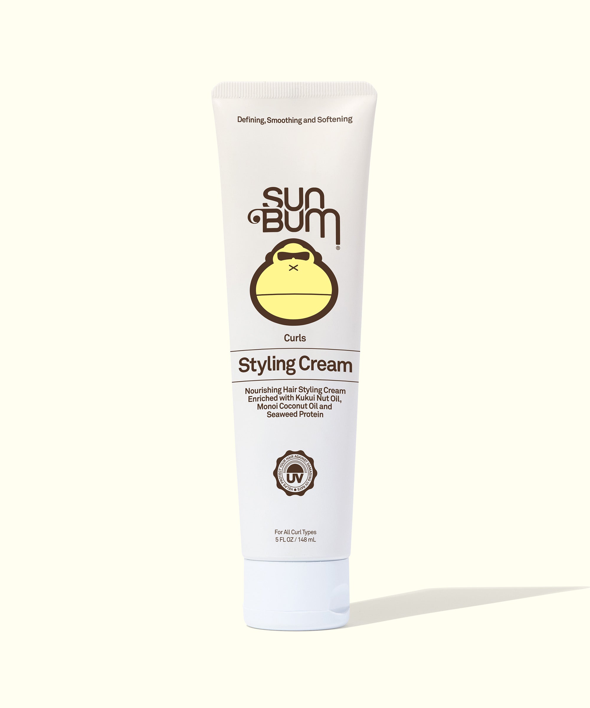 Tube of lightweight Curls Styling Cream by Sun Bum with Kukui Nut Oil and Monoi Coconut Oil for soft, nourished curls.