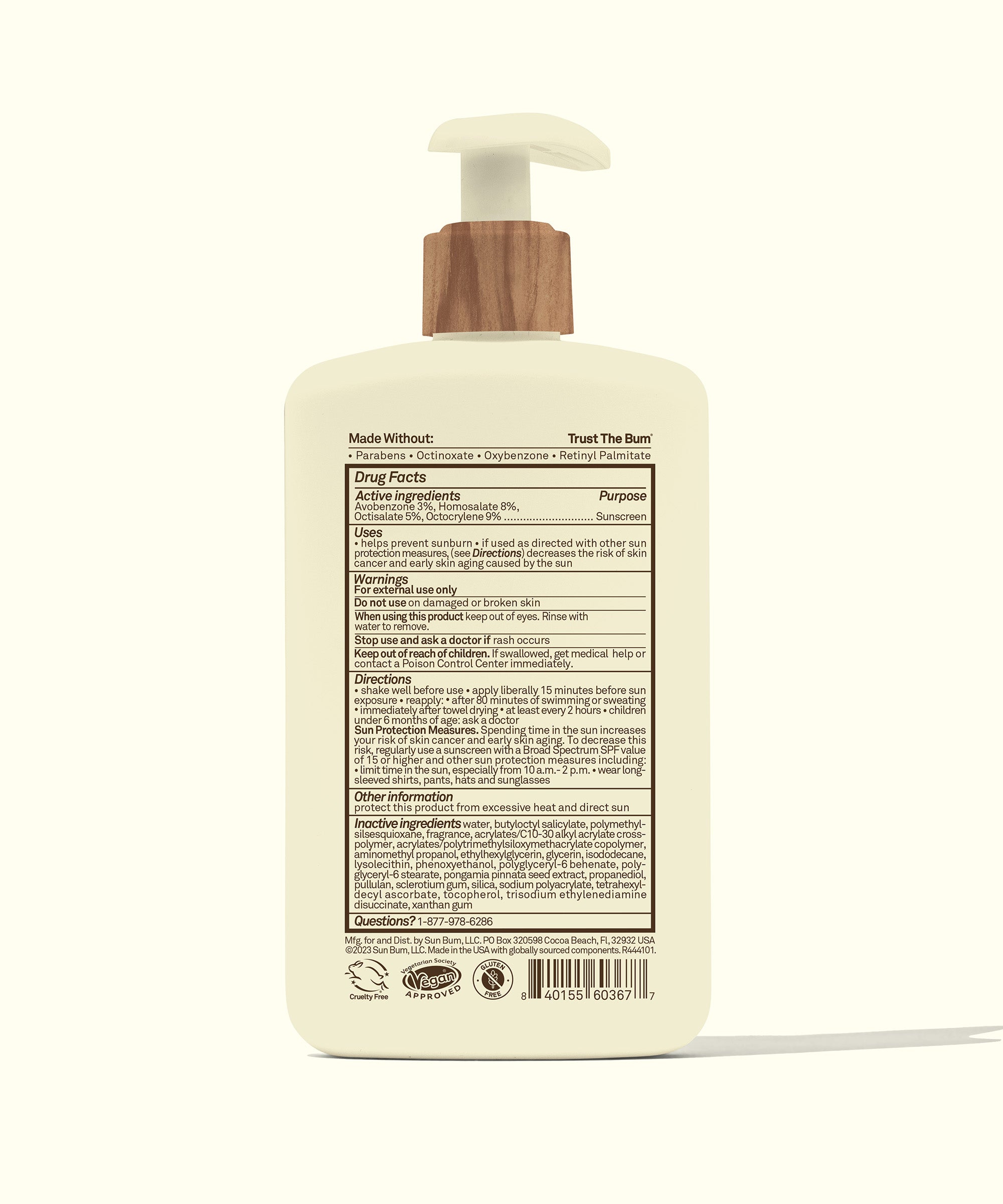 Bottle with wooden pump on a white background