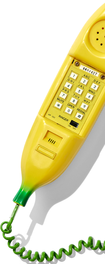 Yellow telephone with green hook on white background