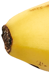 Close-up of a yellow banana with brown spots