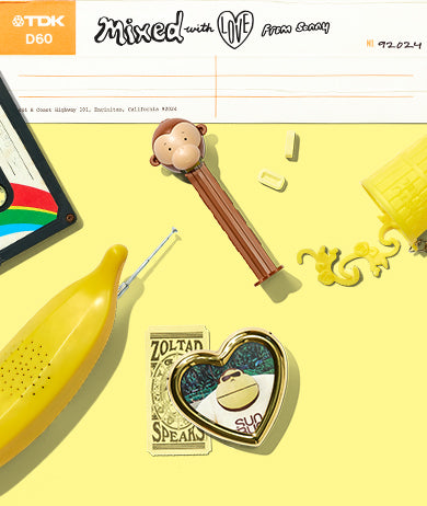 Various toys and objects laying on a yellow background