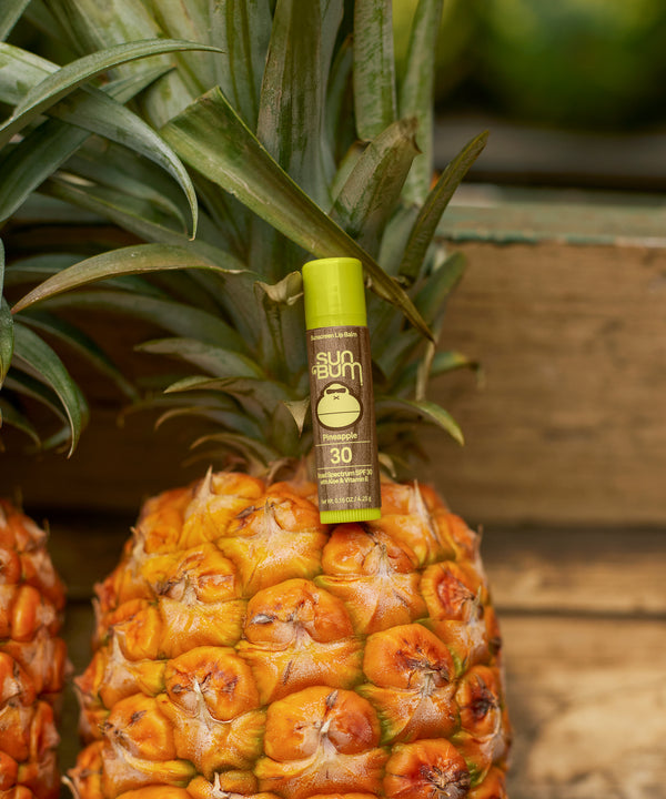 SPF 30 Sunscreen Lip Balm in a pineapple flavor with Aloe and Vitamin E for all-day protection and moisture, Sun Bum.