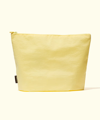 Build Your Own Bag in pastel yellow canvas with gold zipper closure - Sun Bum