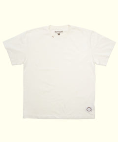 Original Tee (Cream), a 100% cotton short sleeve shirt laid flat with a small logo patch