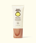 Sun Bum Daily Glow bottle on a cream background