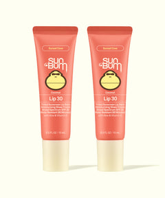 Two Sun Bum Sunset Cove Coconut Lip 30 tinted sunscreen lip balms in coral packaging, part of Tinted Lip Duos