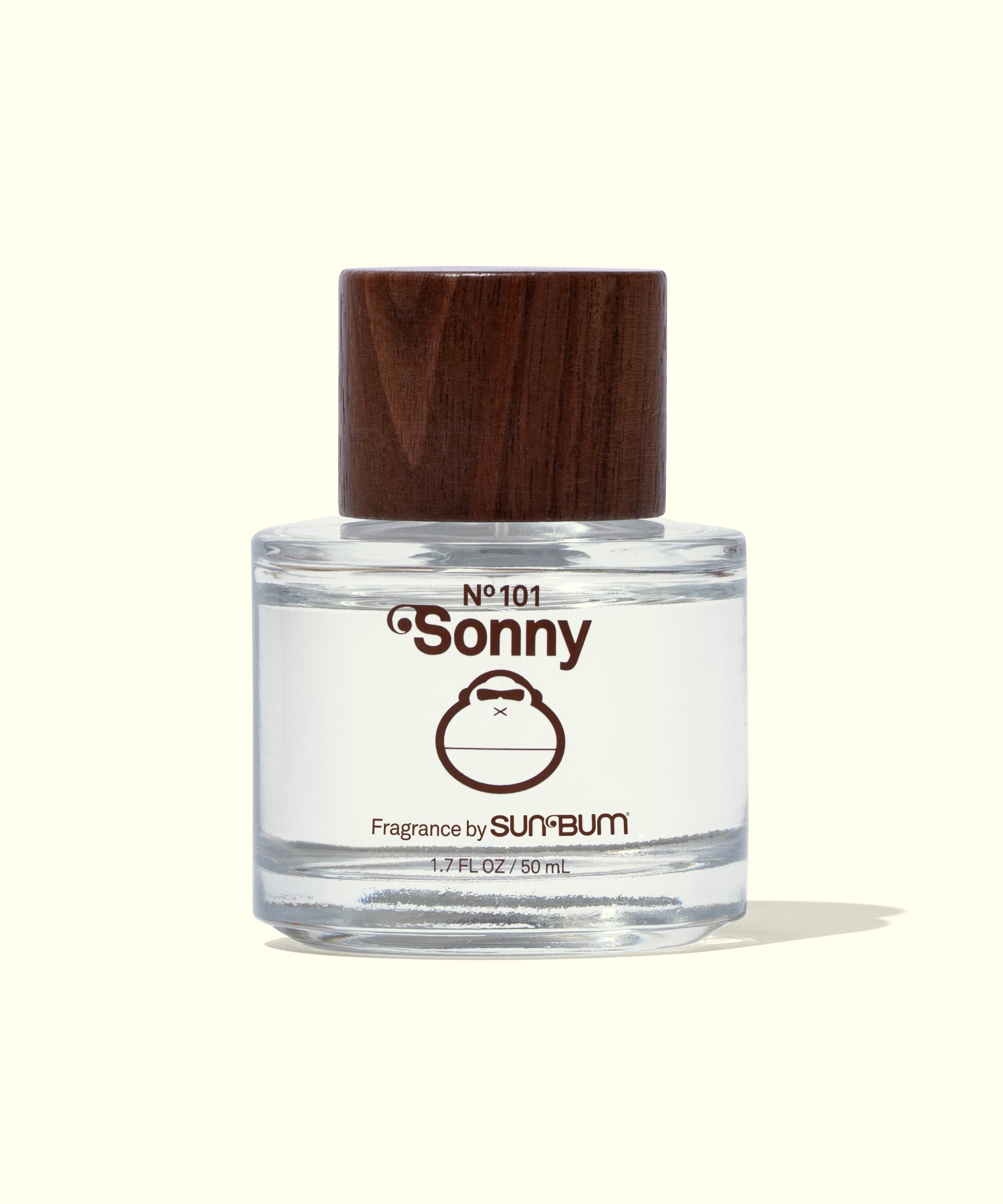 Clear bottle of 'Sonny' fragrance with a wooden cap on a white background