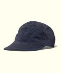 Navy blue cap with black mesh back and 'petit main' branding on a white background