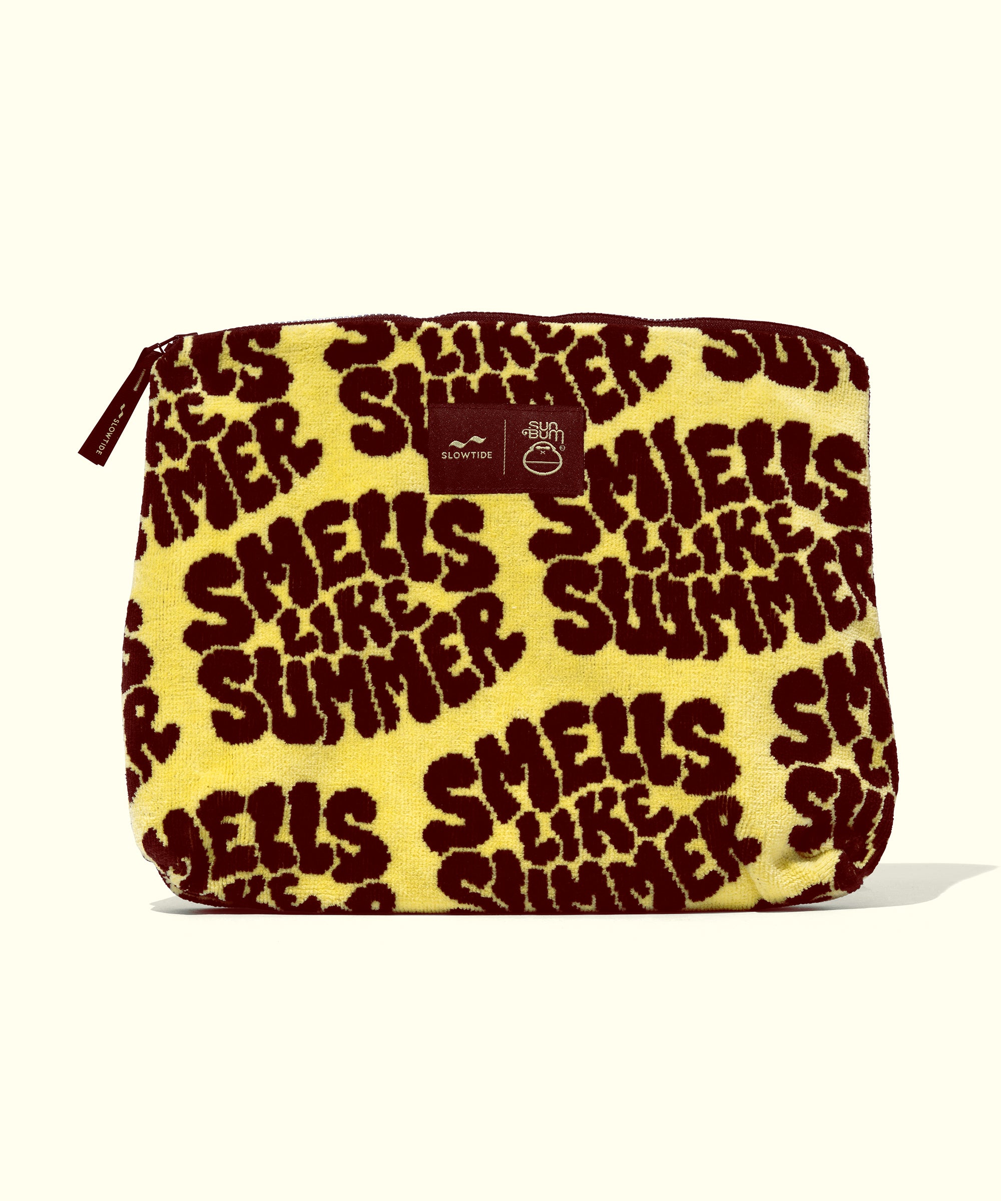 Yellow pouch with brown text 'SMELLS LIKE SUMMER' on a white background