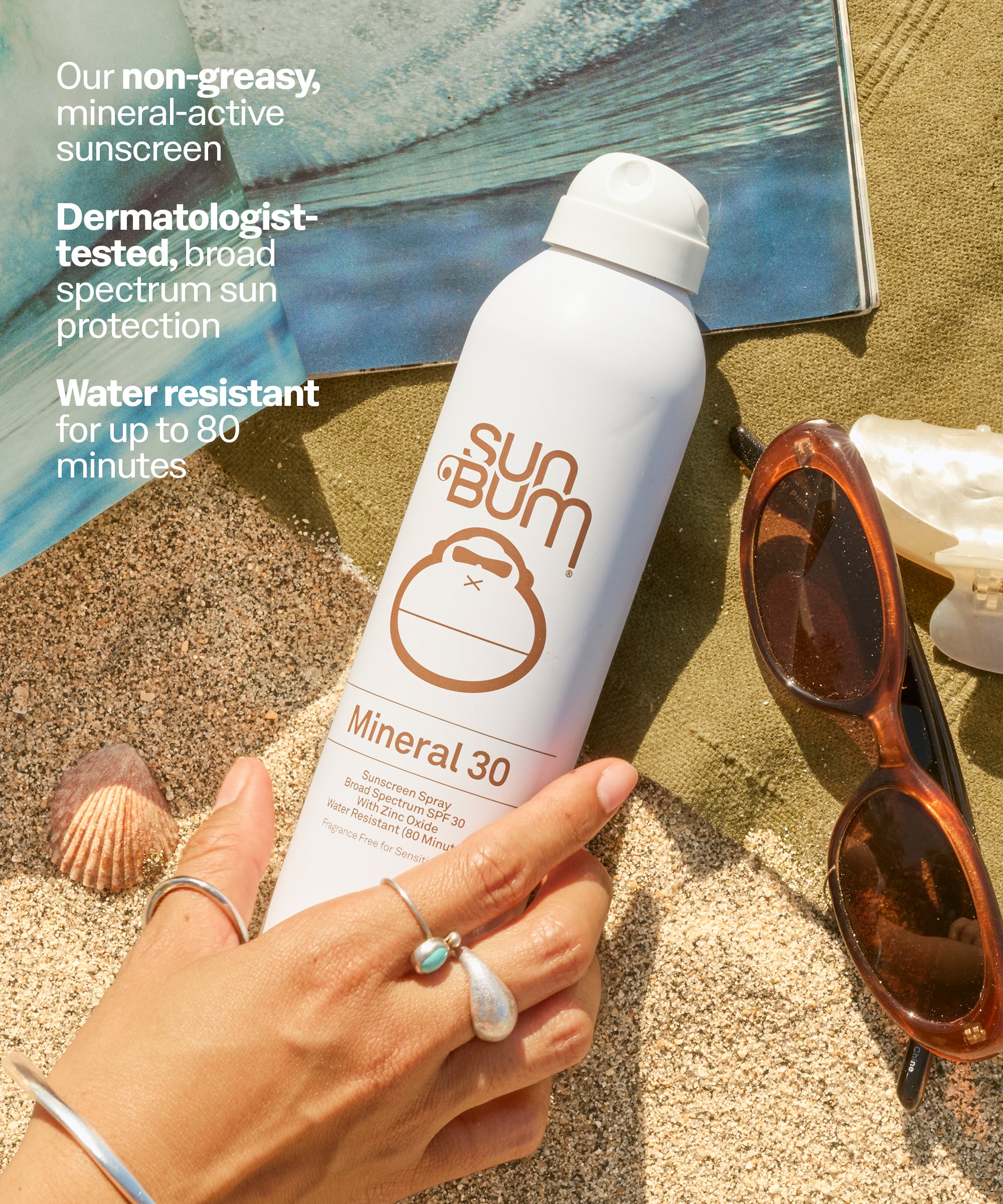 Sun Bum Mineral 30 sunscreen spray held by a hand on sand with sunglasses and shells in the background. Our non-greasy, mineral-active sunscreen
Dermatologist-tested, broad spectrum sun protection
Water resistant
for up to 80 minutes