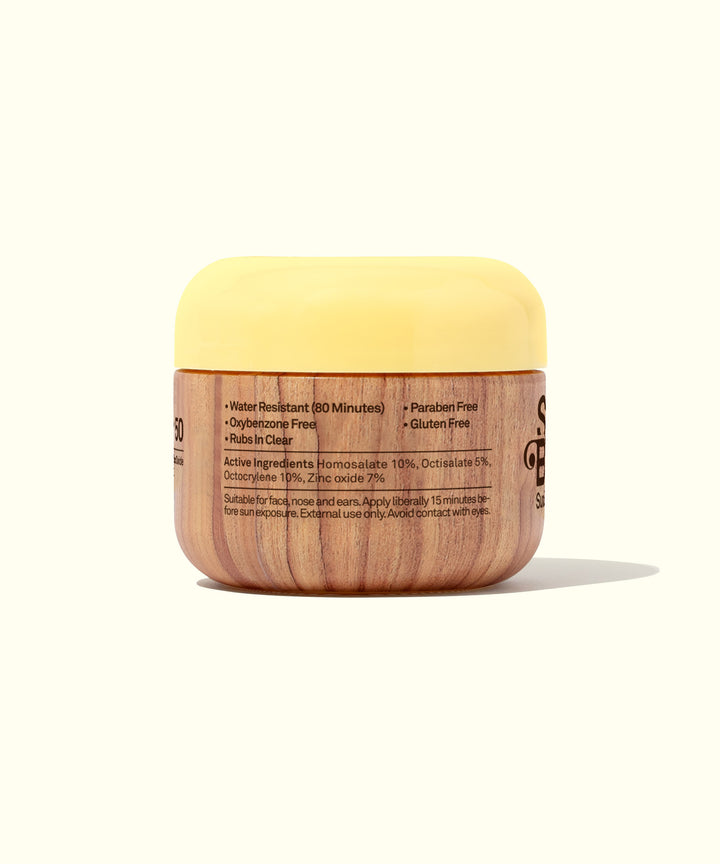 Original SPF 50 Clear Lotion with Aloe and Vitamin E in a wooden-themed container and yellow cap. Sun Bum.