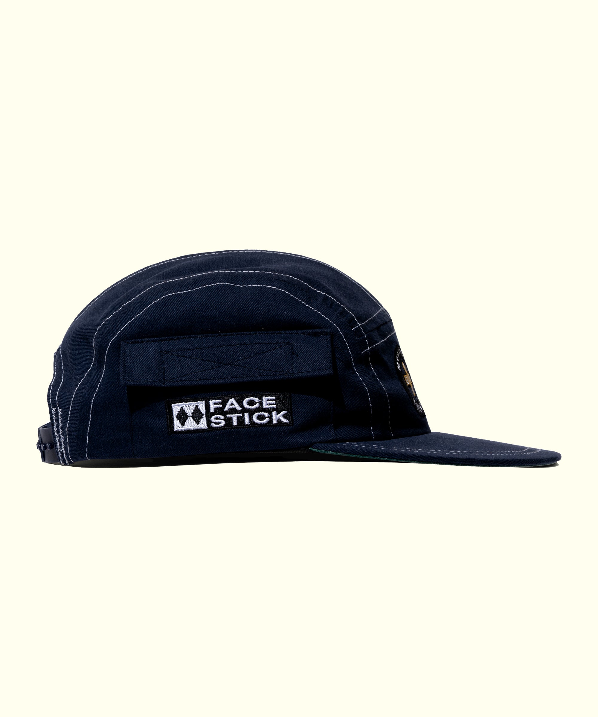 Navy blue cap with 'Face Stick' logo on a white background