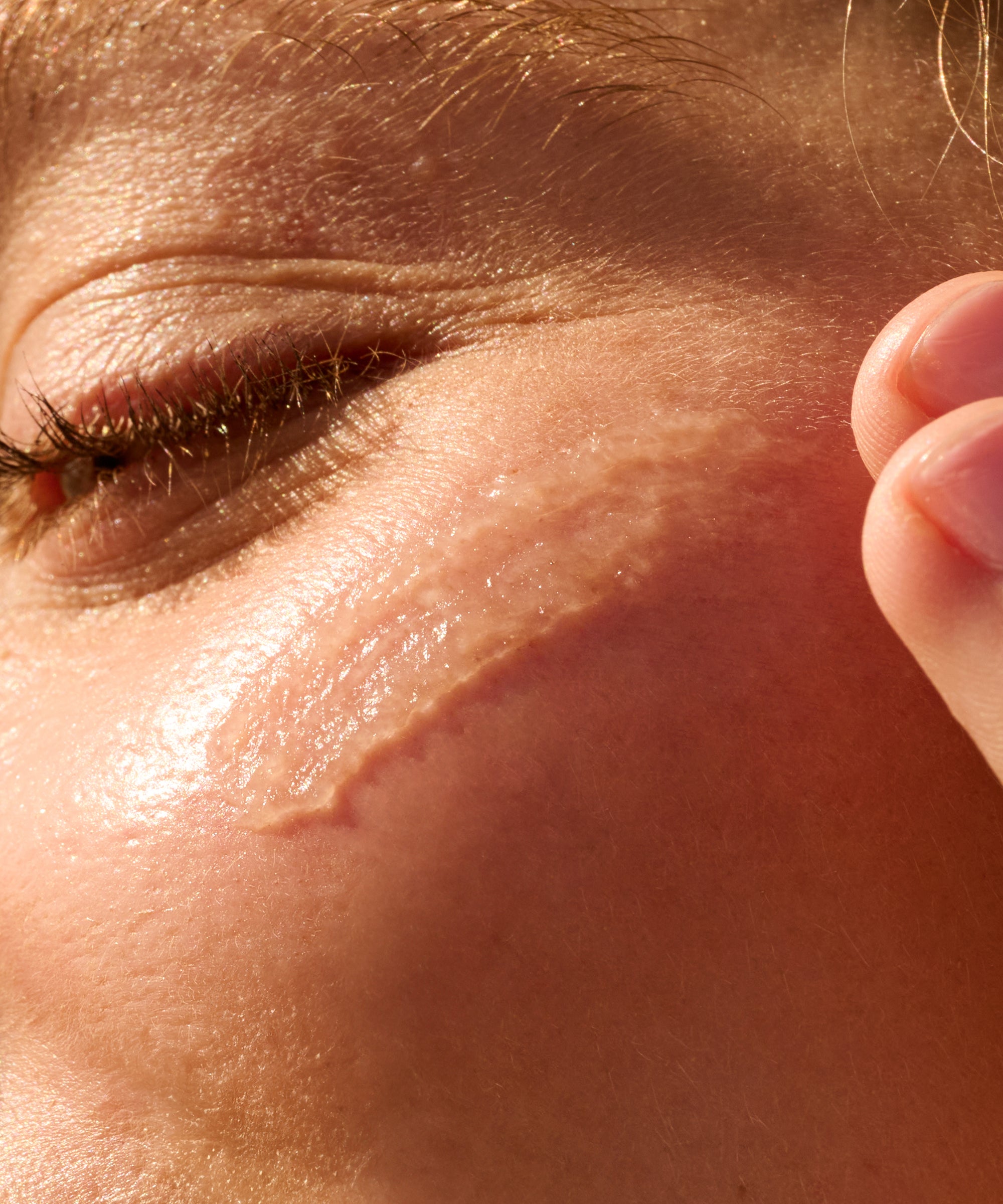 Close-up of a person's eye with a focus on the skin texture.
