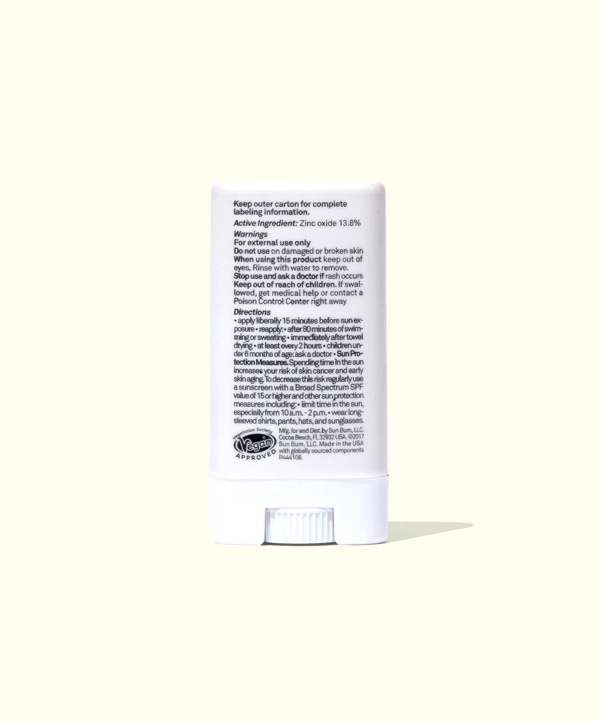 White stick of balm with text on a white background