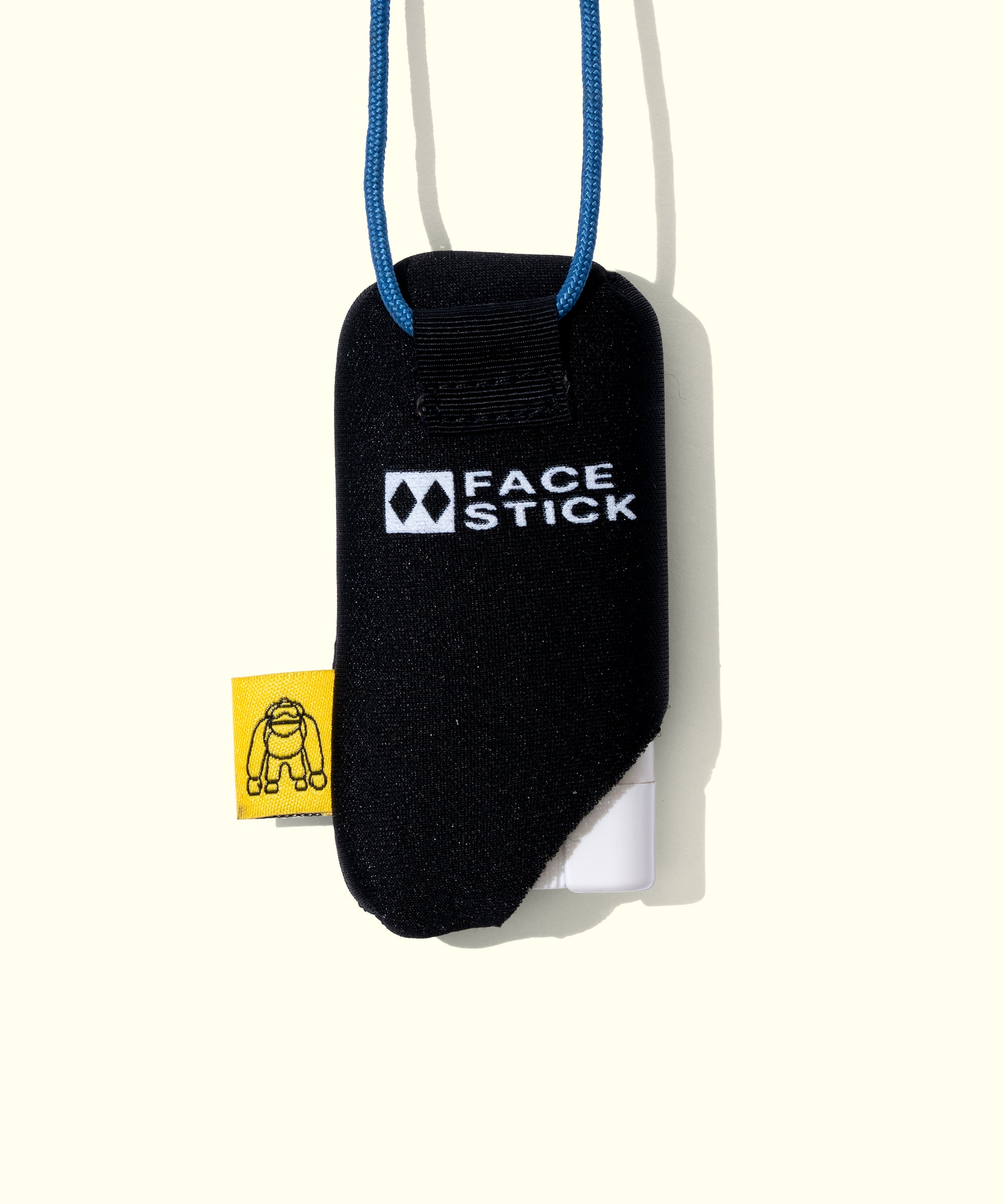 Black face stick case with 'Face Stick' branding on a white background