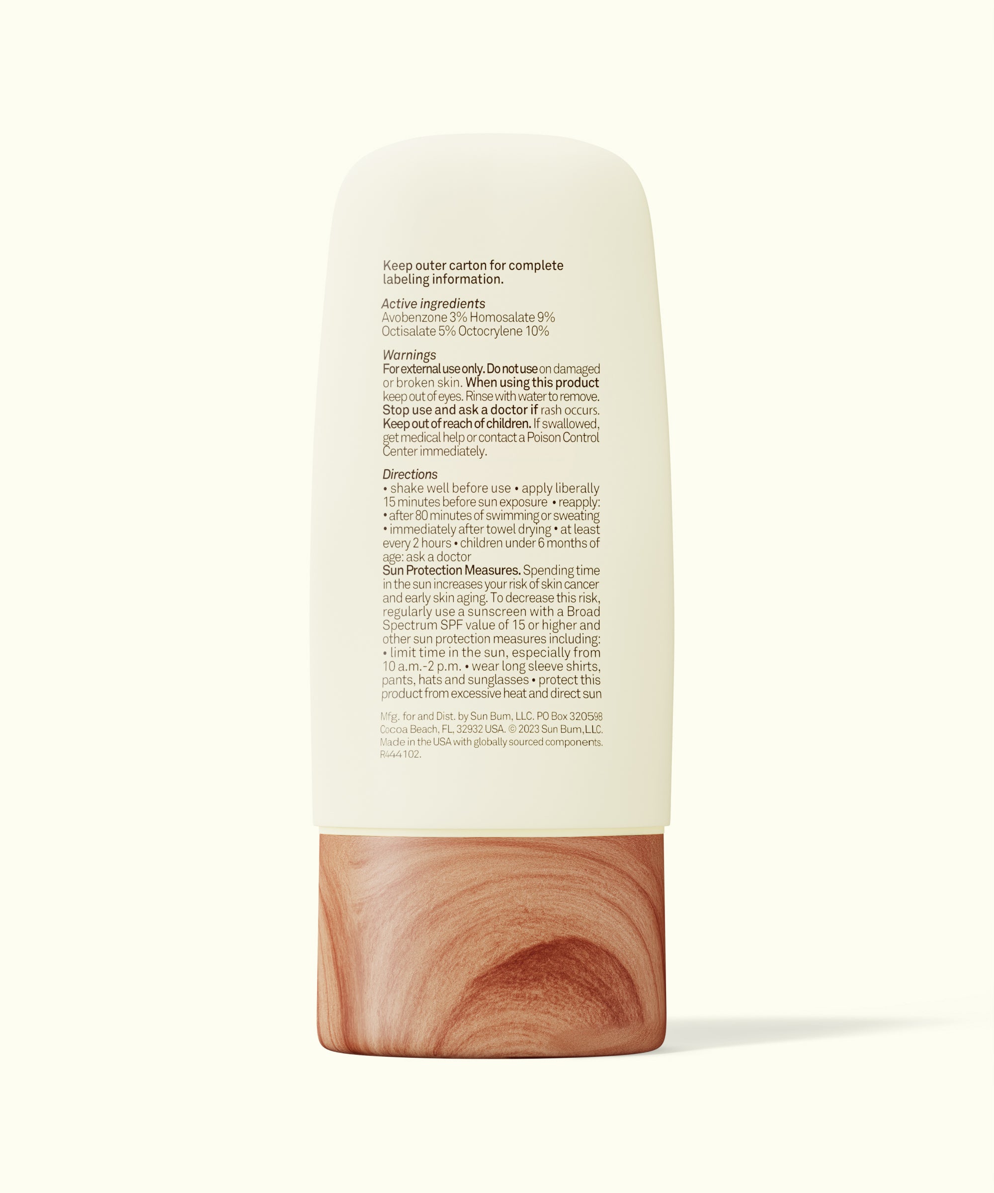 Skincare product with wooden base and white label on a white background