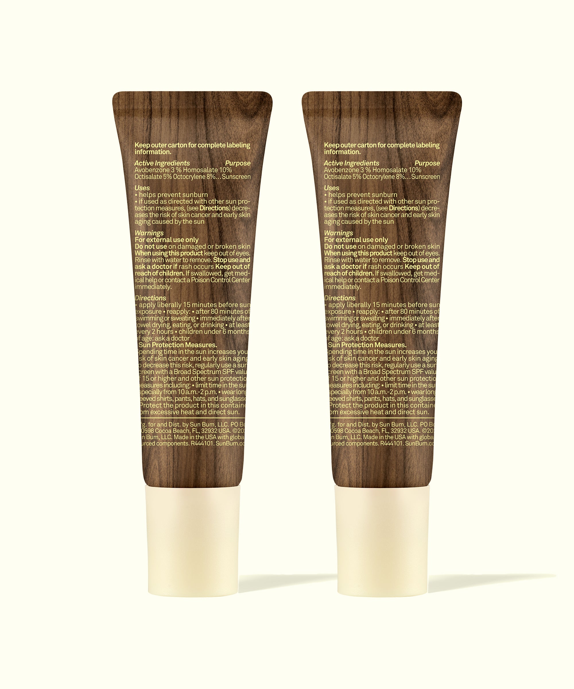 Back view of two Sun Bum Lip 30 Duo: Clear + Clear tubes showing product labeling and usage instructions.