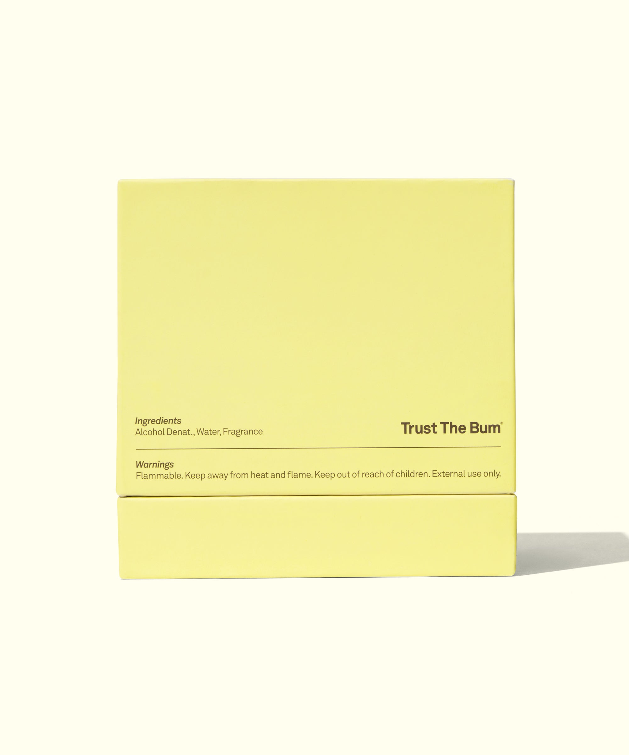 Yellow packaging box with 'Trust The Bum' branding on a white background