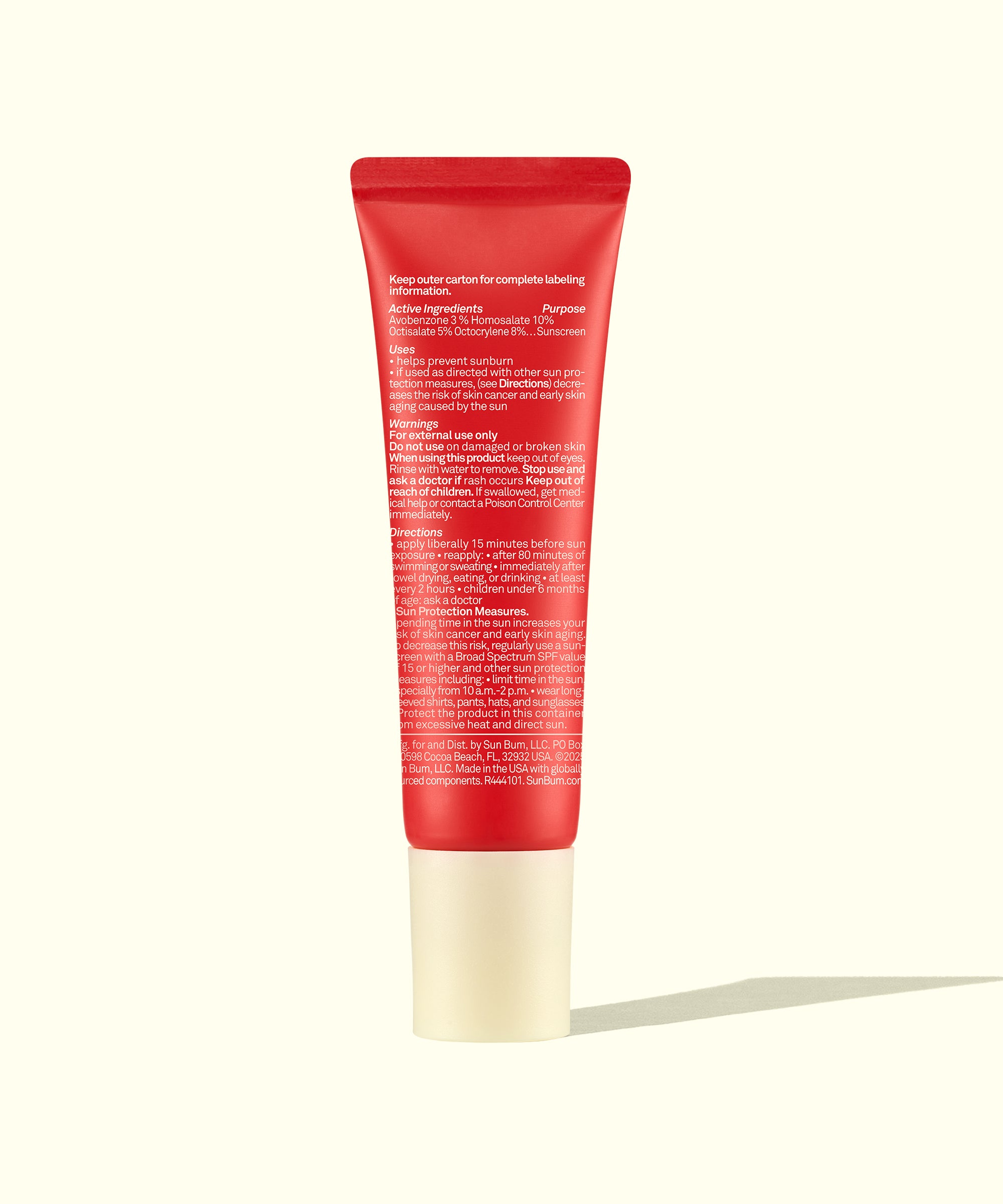 Red skincare tube on a white background