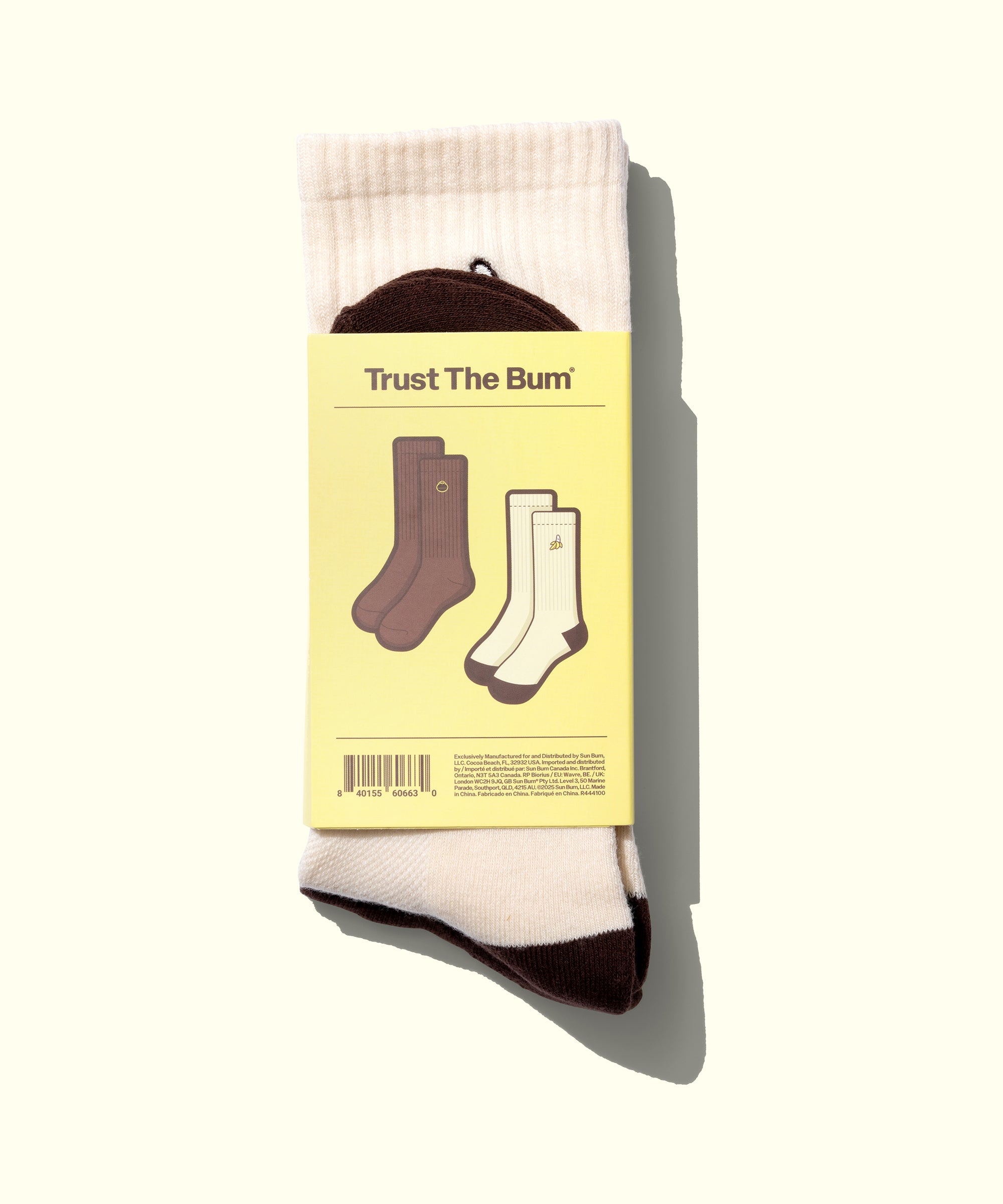 Packaged socks with a yellow label on a white background