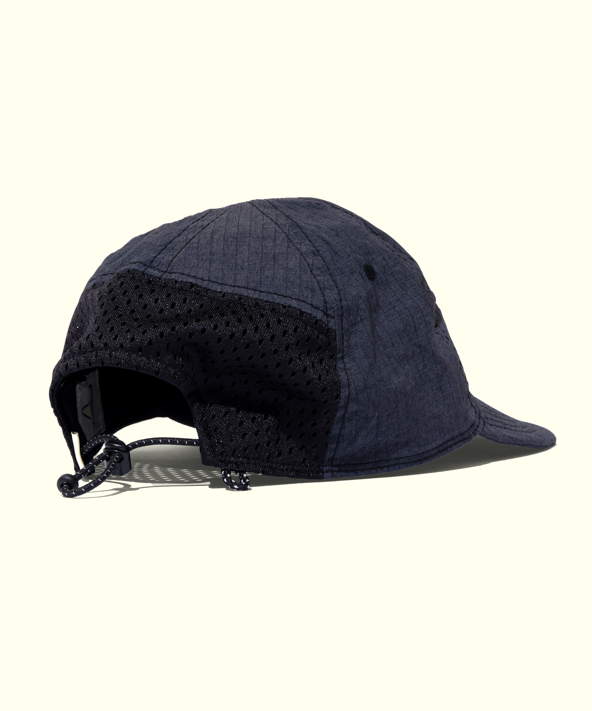 Navy blue cap with a mesh back on a white background
