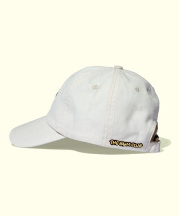 White casual cap with "The Bum Club" patch on back, perfect for sunny days, The Bum Club Hat by Sun Bum.