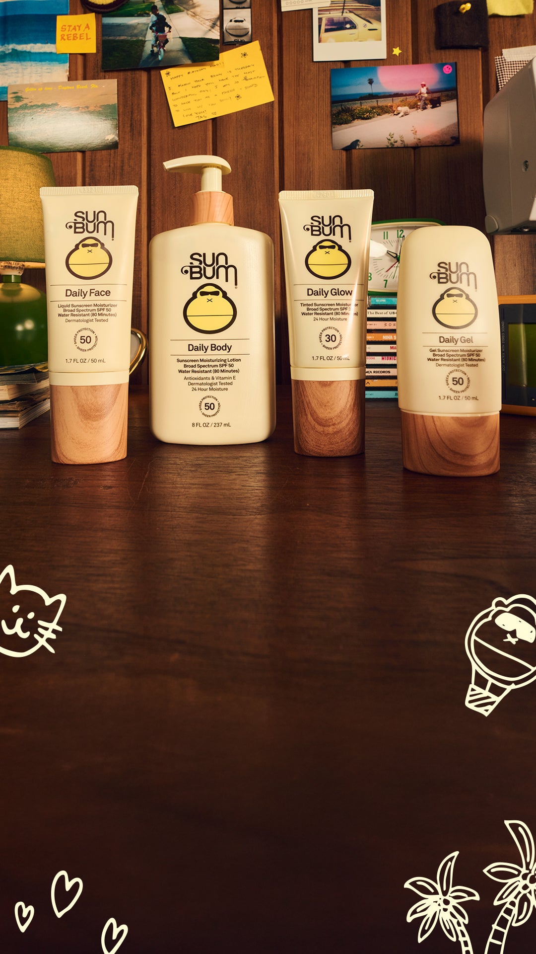 Sun Bum skincare products on a wooden surface with decorative elements.