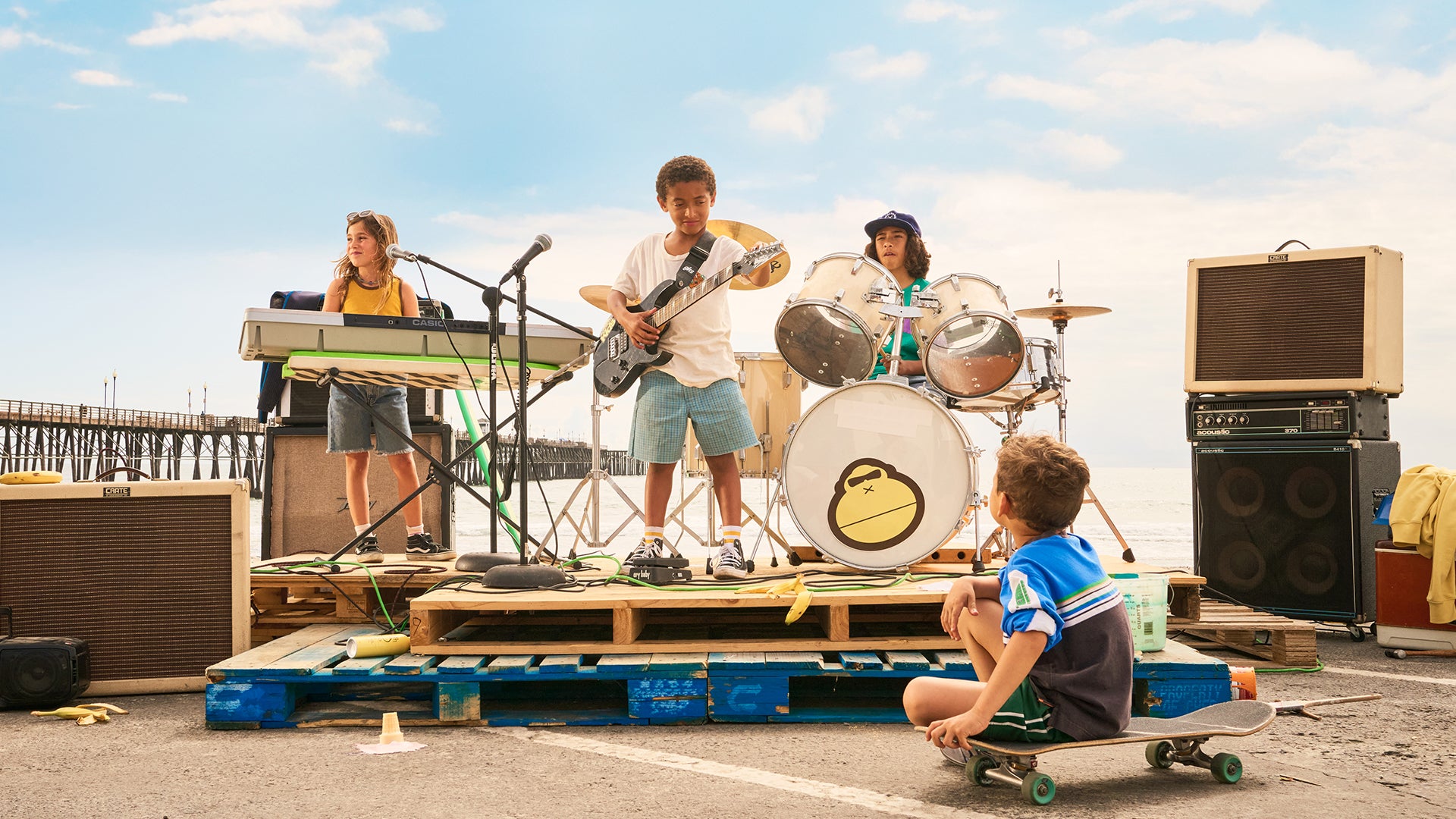 Kids rock out by the beach with instruments and Sun Bum gear, celebrating sun-safe fun outdoors – Kids Collection - Sun Bum