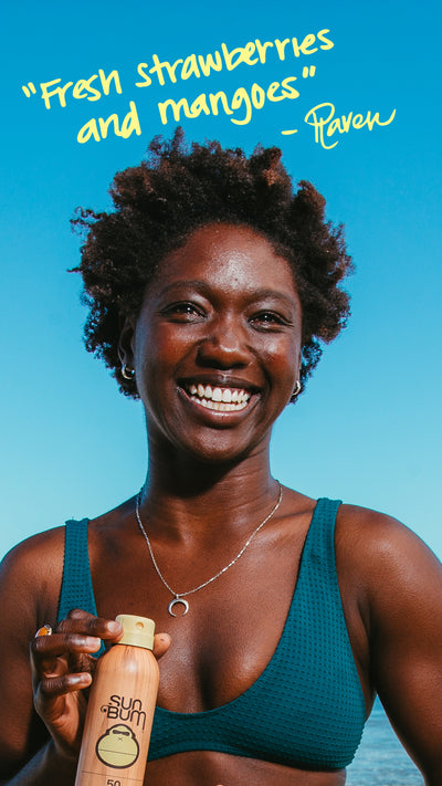 Woman holding a bottle of sunscreen with text 'Fresh strawberries and mangoes' quote on a blue background