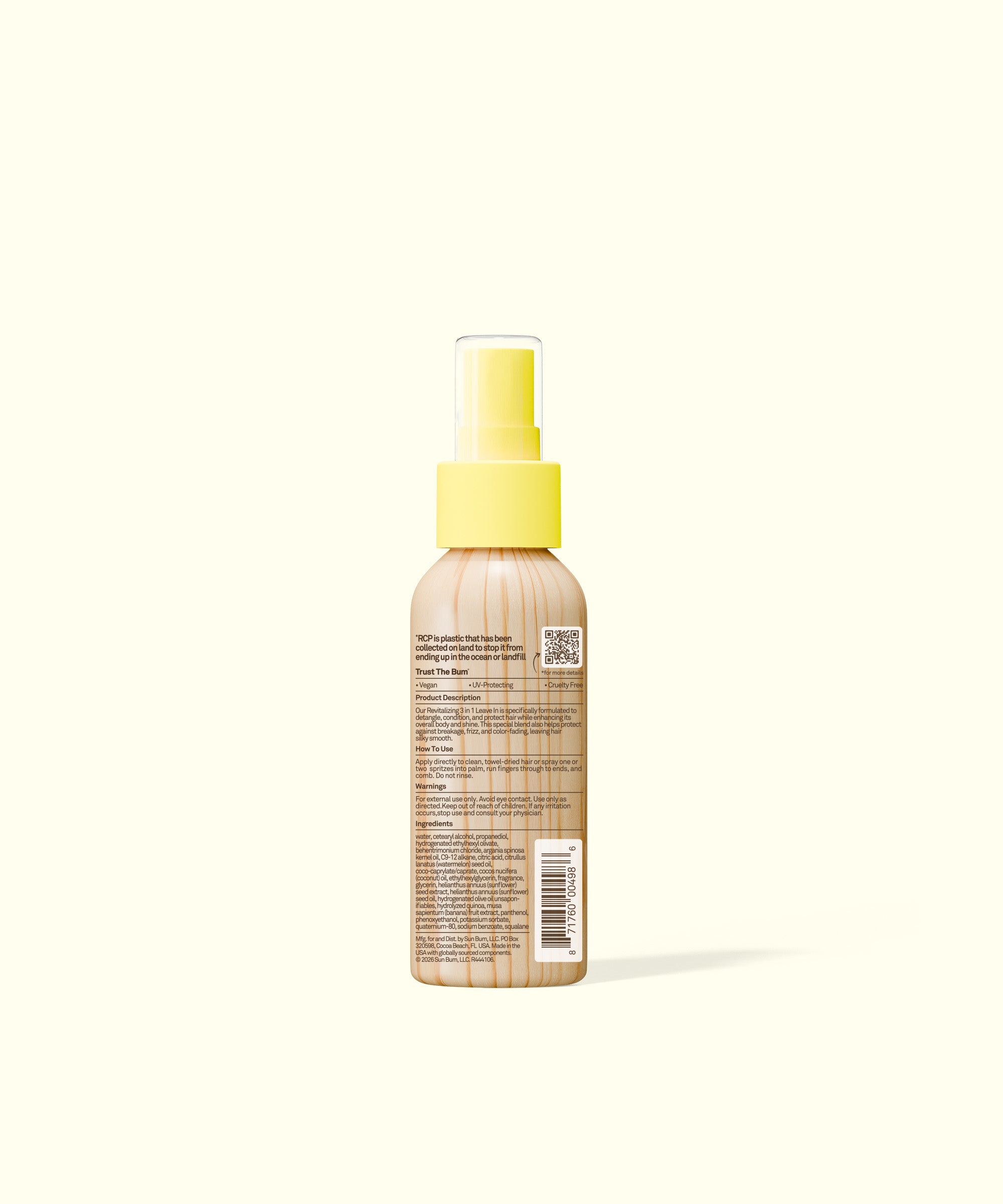 Spray bottle with yellow cap on a white background