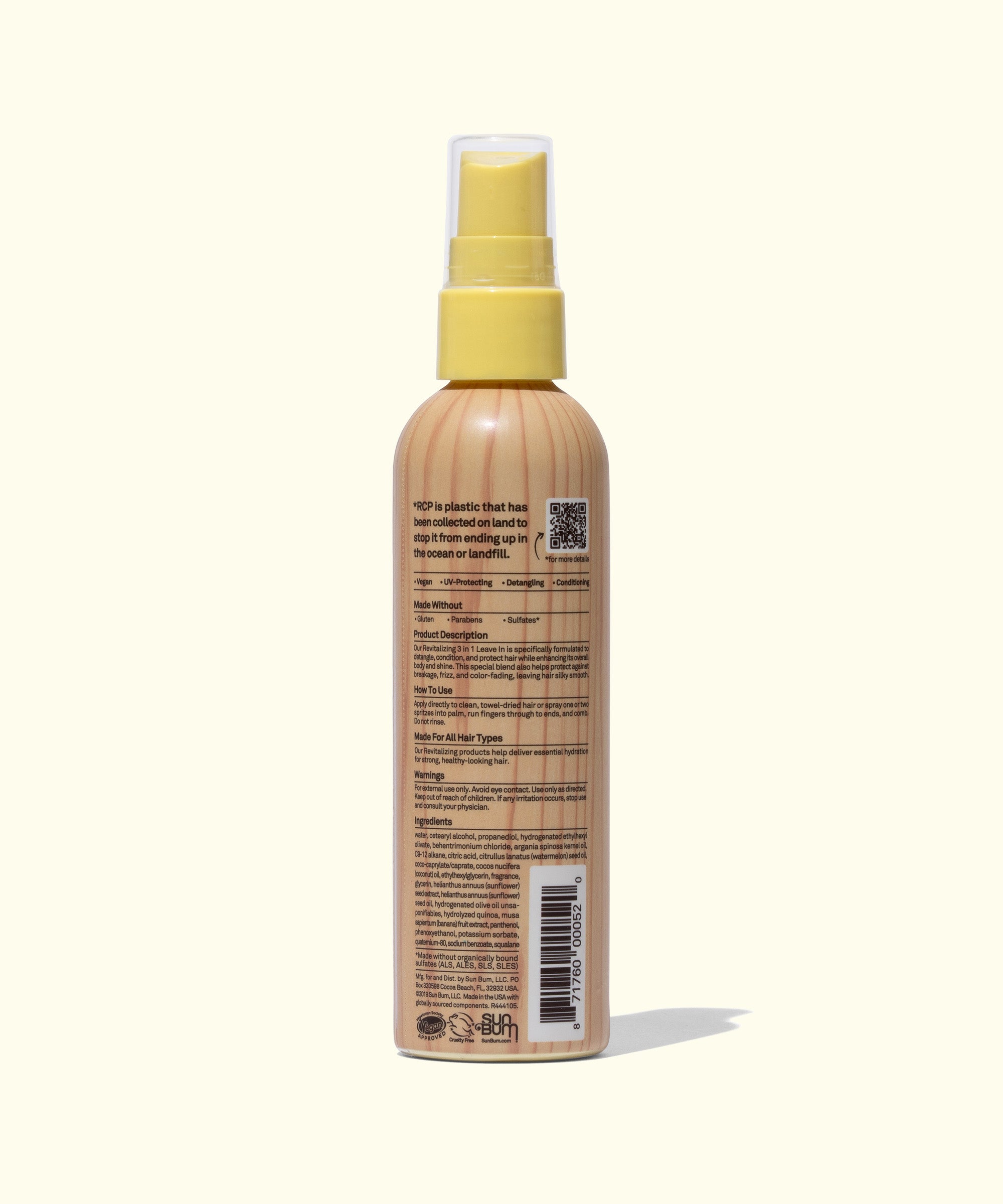 Spray bottle with a wooden texture and yellow cap on a white background