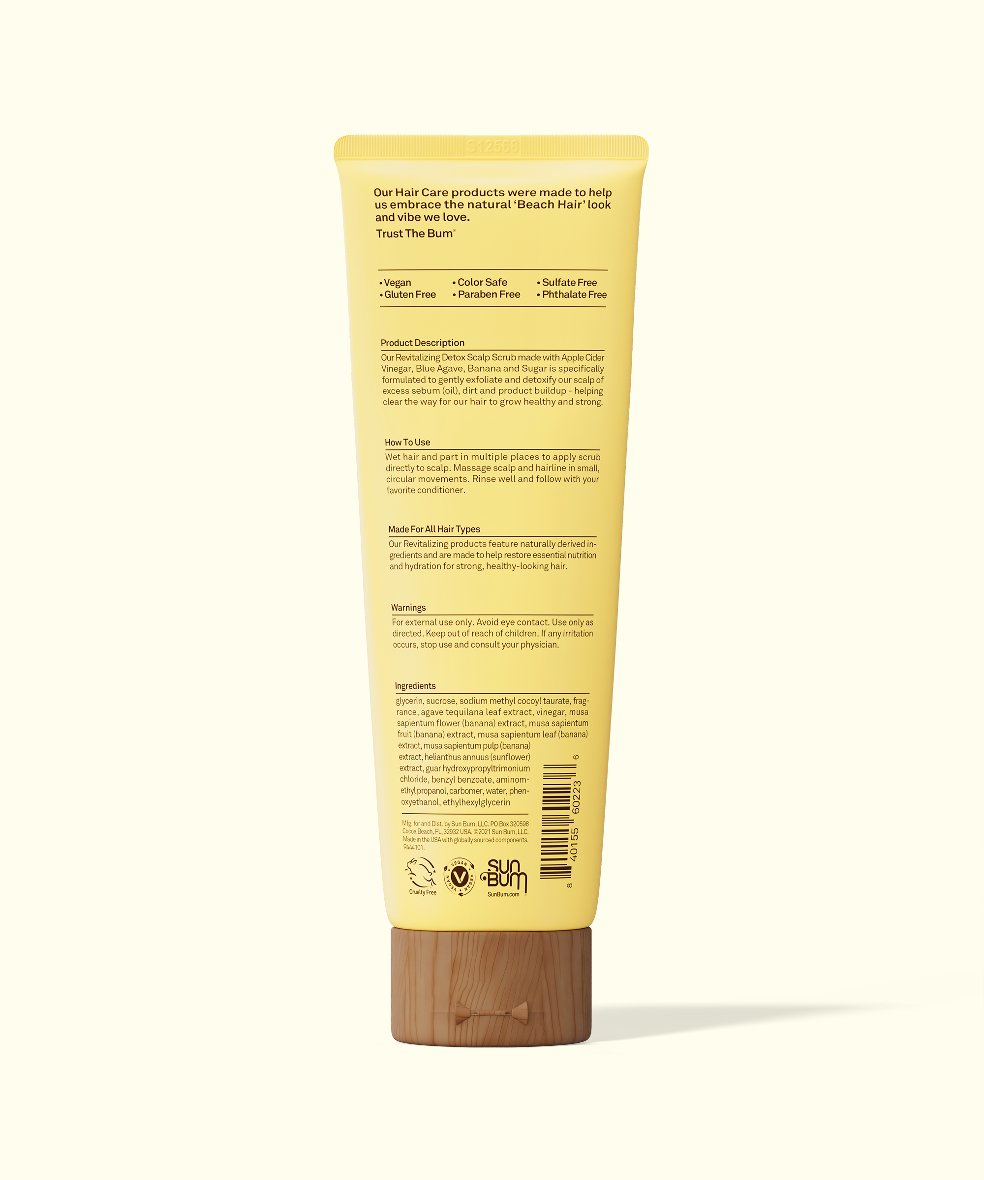 Yellow tube of hair care product with text on a white background
