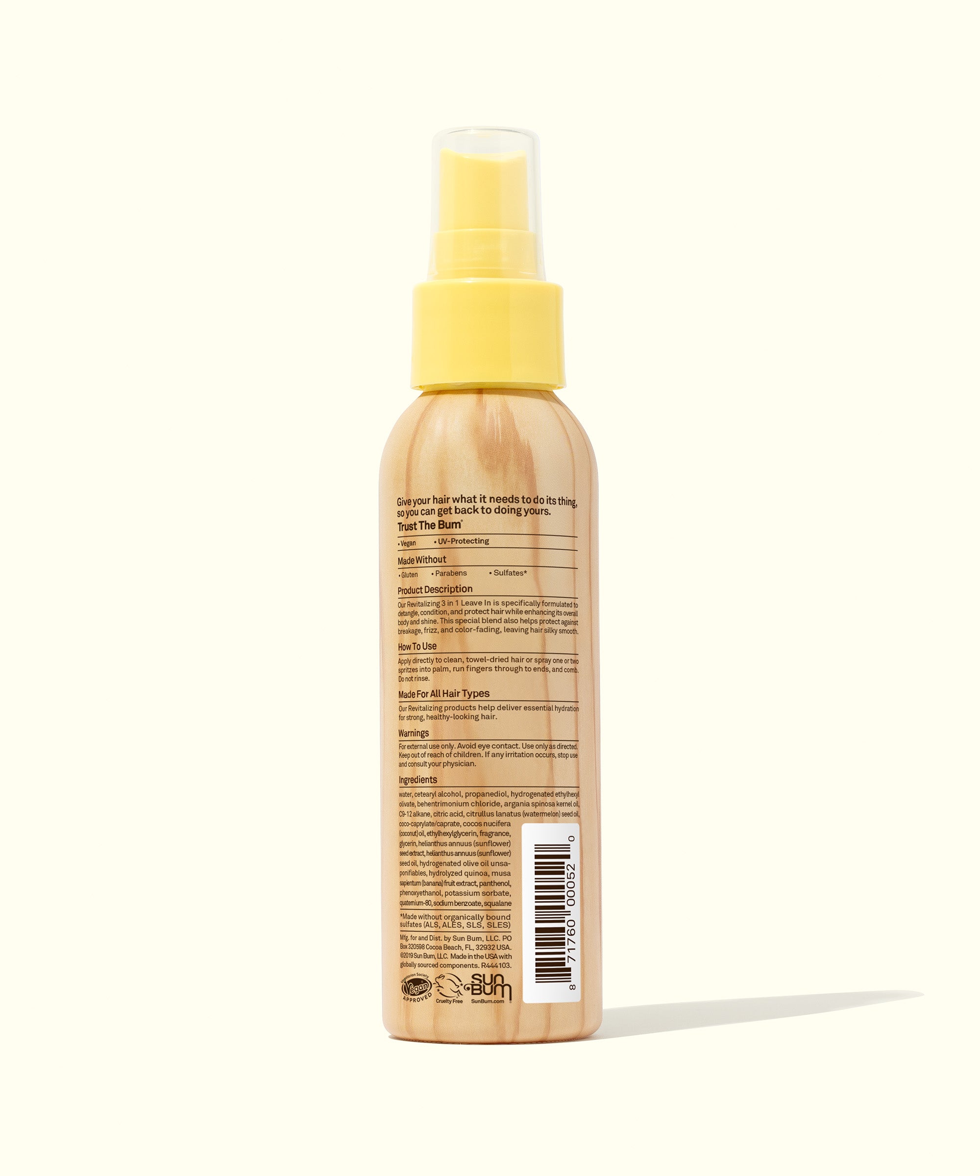 Hair spray bottle with yellow cap on a white background