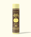 Sun Bum sunscreen lip balm tube with banana flavor on a white background