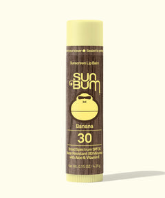 Sun Bum sunscreen lip balm tube with banana flavor on a white background