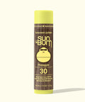 Sun Bum Pineapple sunscreen lip balm on a white background