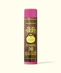 Sun Bum lip balm with a brown stick and pink cap on a white background