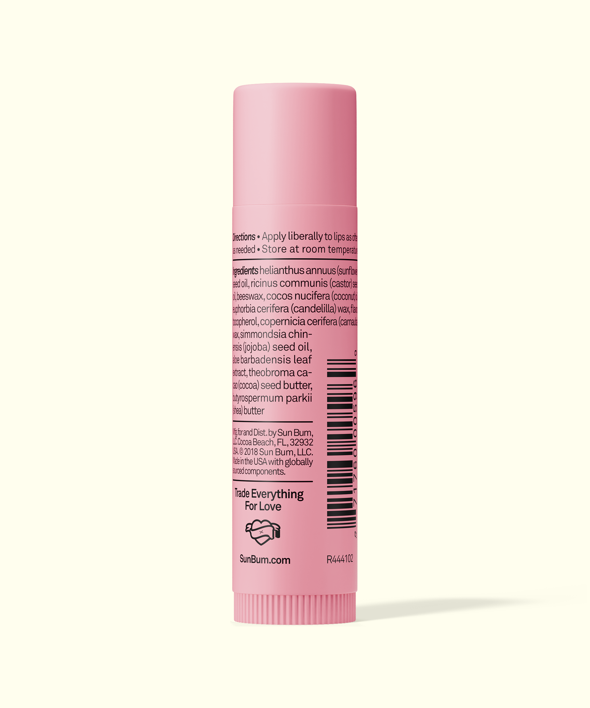 Pink tube of lip balm with text and a barcode on a white background