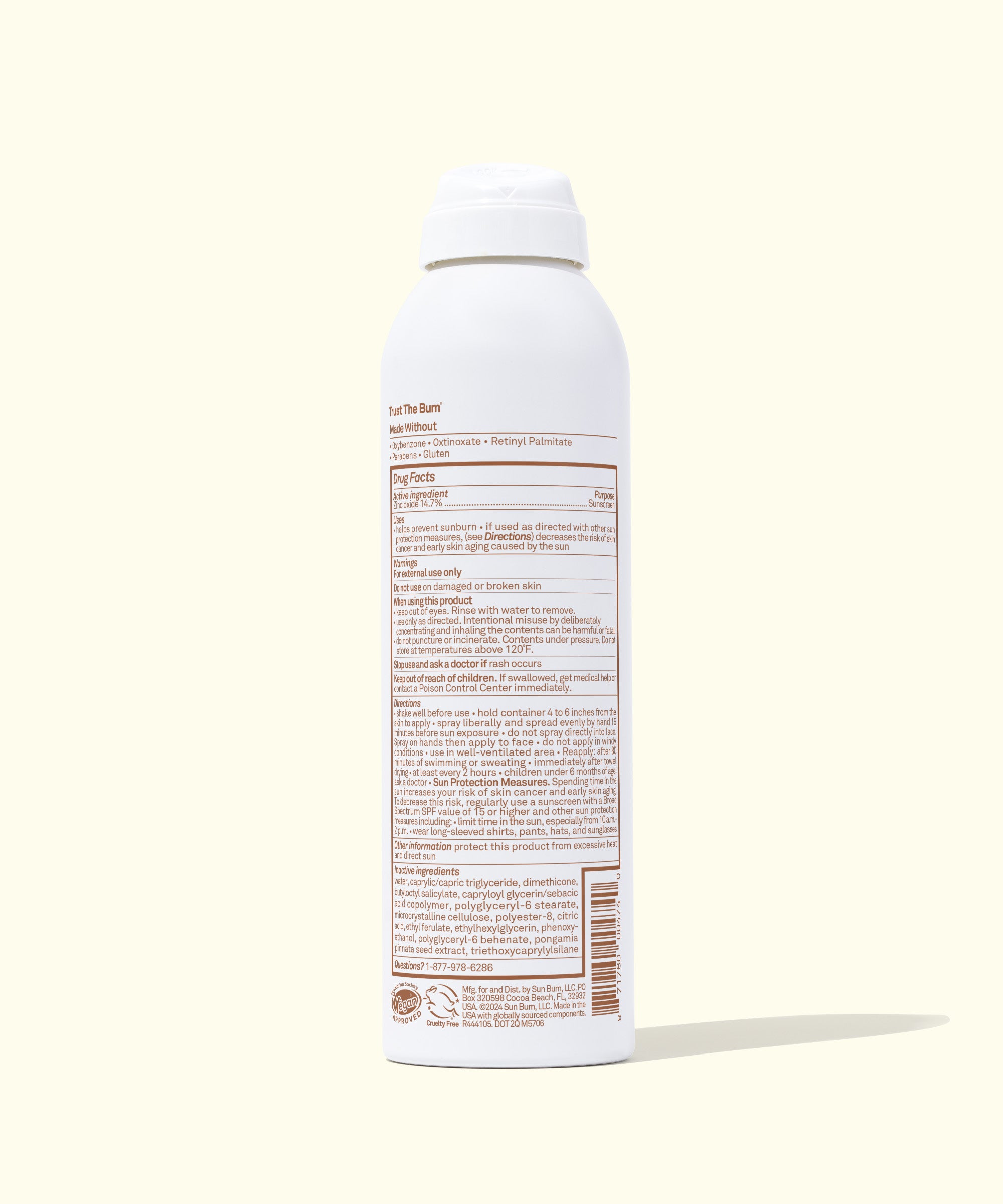 White spray bottle with a label on a white background