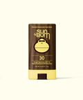 Sun Bum sunscreen stick with brown and yellow design on a white background