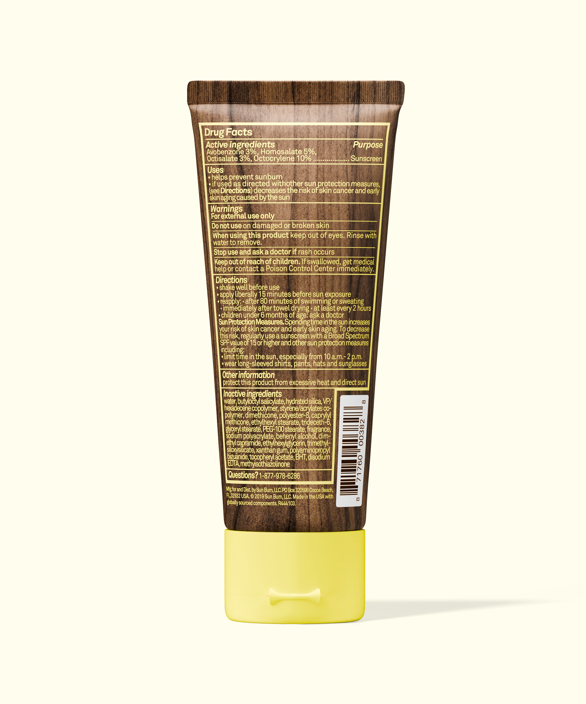Back view of Sun Bum Original SPF 30 Sunscreen Lotion tube with drug facts and directions on wooden background
