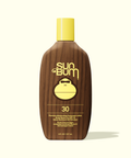 Sun Bum sunscreen lotion bottle with brown body and yellow cap on a white background