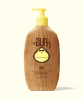 Sun Bum SPF 50 lotion bottle with wooden texture and yellow pump on a white background