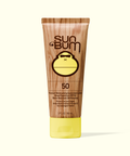 Sun Bum sunscreen tube with wooden texture and yellow cap on a white background