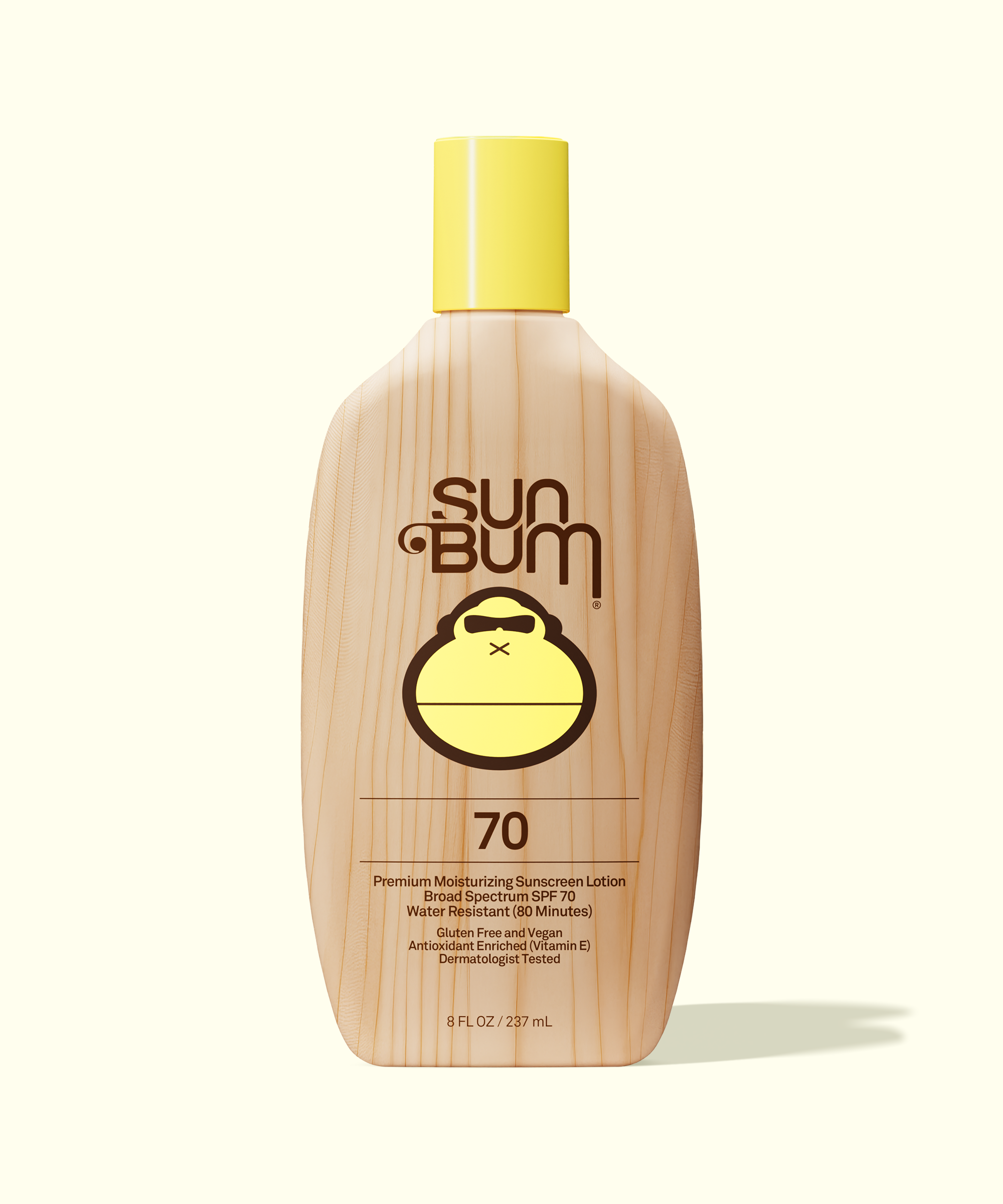 Sun Bum sunscreen lotion bottle with yellow cap on a white background